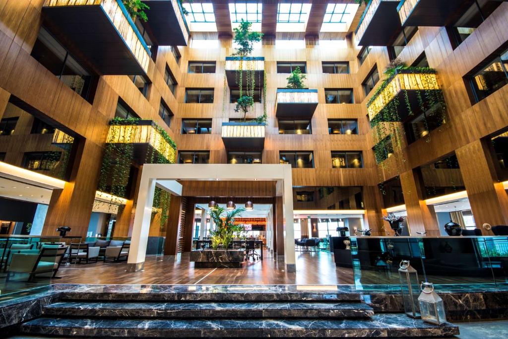 a lobby of a building with stairs in it at Radisson Blu Hotel & Spa, Istanbul Tuzla in Istanbul