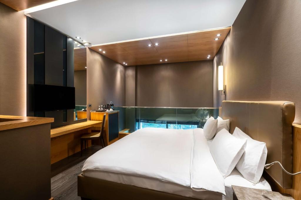 a hotel room with a bed and a television at Radisson Blu Hotel & Spa, Istanbul Tuzla in Istanbul