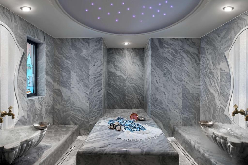 a room with two sinks and a bed in a room at Radisson Blu Hotel & Spa, Istanbul Tuzla in Istanbul