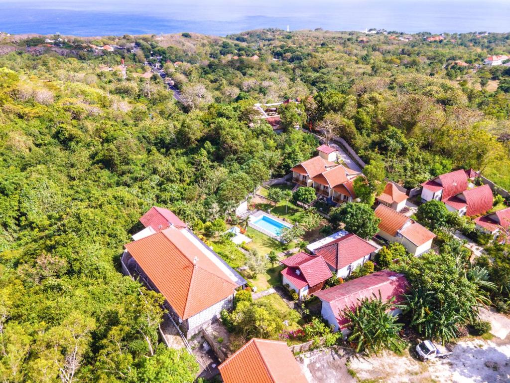 an overhead view of a house in the forest at The Pande Hill Homestay in Uluwatu