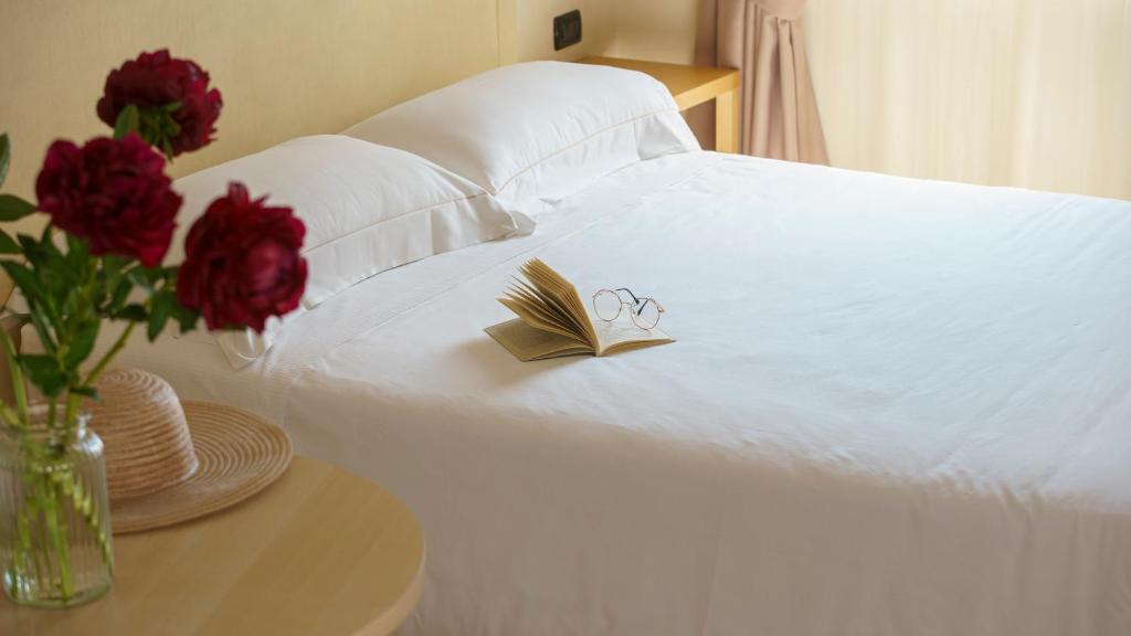 Postel nebo postele na pokoji v ubytování Bes Hotel Villa Zoia