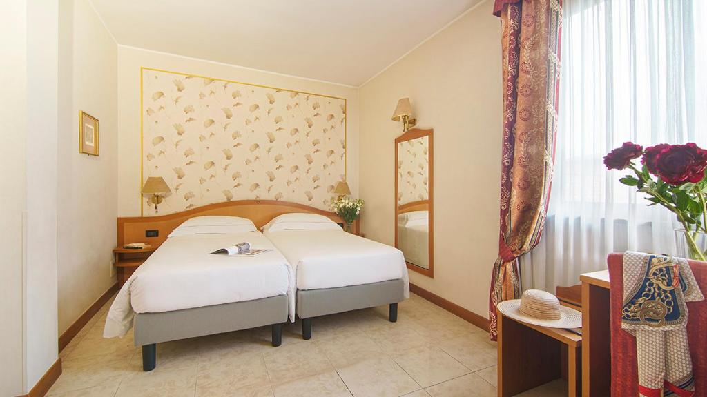 Postel nebo postele na pokoji v ubytování Bes Hotel Villa Zoia