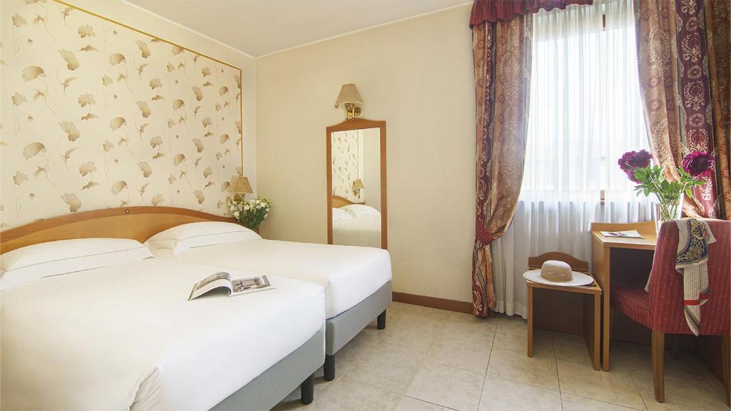 Postel nebo postele na pokoji v ubytování Bes Hotel Villa Zoia