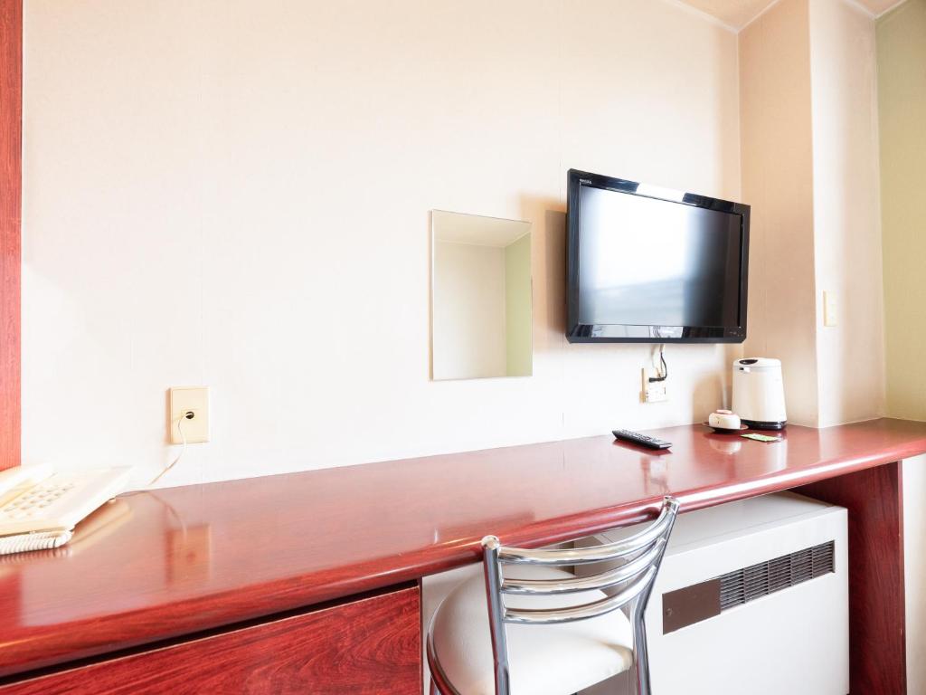 TV a/nebo společenská místnost v ubytování Tabist Travel Inn Shinshu Nakano