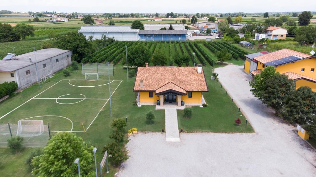 an aerial view of a house with a basketball court at Agriturismo Tiare dal Gorc in Gorgo