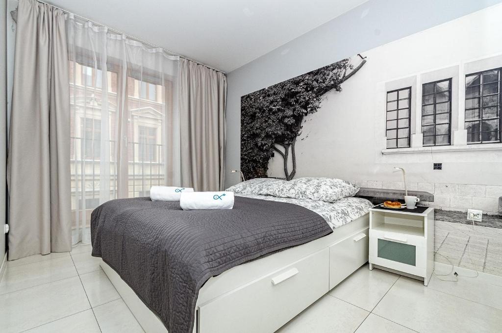 Posteľ alebo postele v izbe v ubytovaní Landmark Apartments