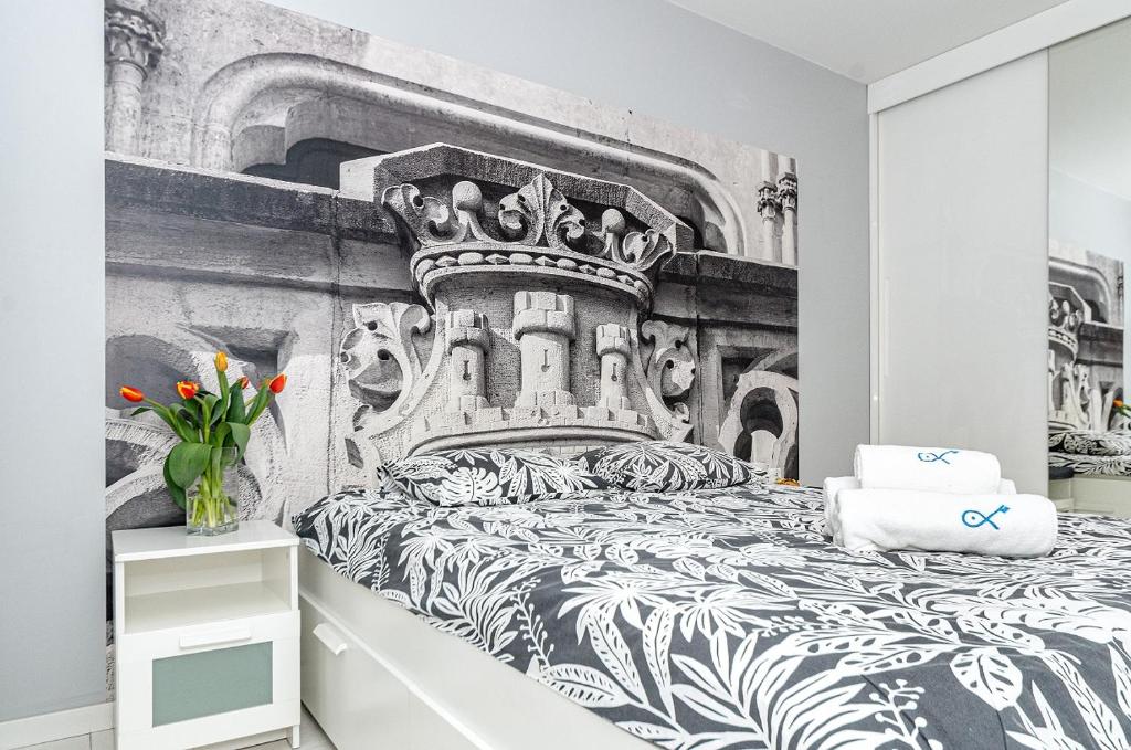 Posteľ alebo postele v izbe v ubytovaní Landmark Apartments