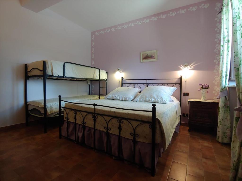 Posteľ alebo postele v izbe v ubytovaní Tenuta Bellaprima CALTAGIRONE