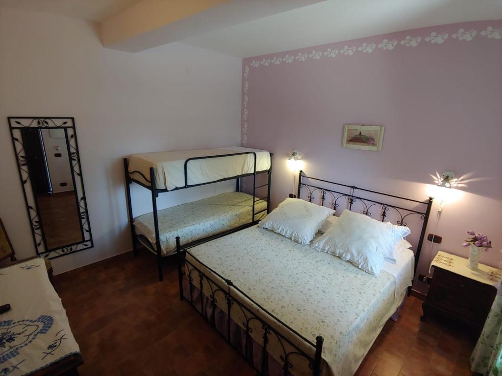 Posteľ alebo postele v izbe v ubytovaní Tenuta Bellaprima CALTAGIRONE