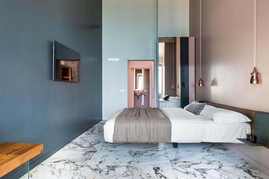 Postel nebo postele na pokoji v ubytování Vulcano Palace