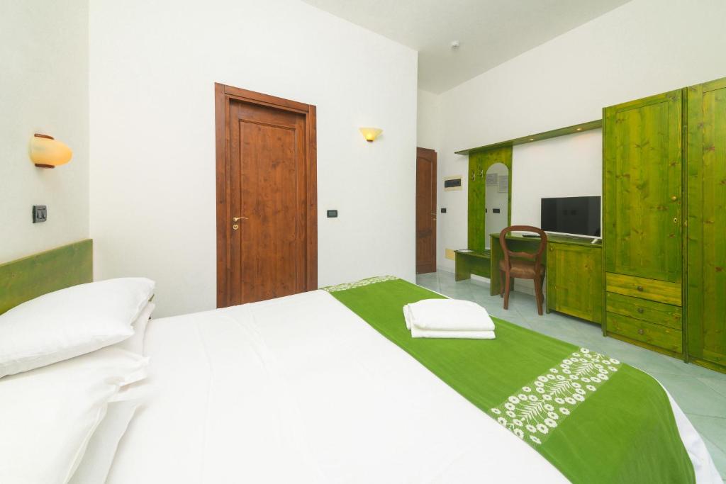 Postel nebo postele na pokoji v ubytování Hotel Pineta