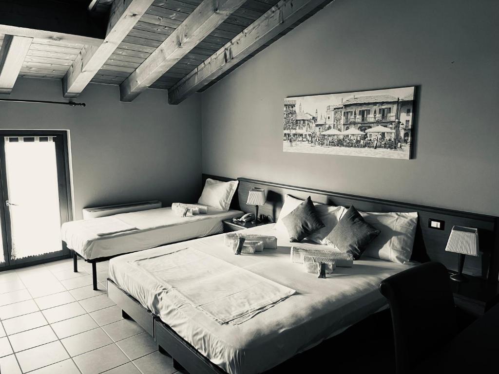 Postel nebo postele na pokoji v ubytování Hotel Al Bosco