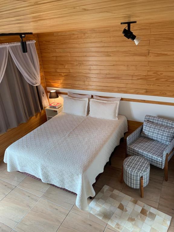 Postel nebo postele na pokoji v ubytování Aconchego do Sereno Exclusive Chales