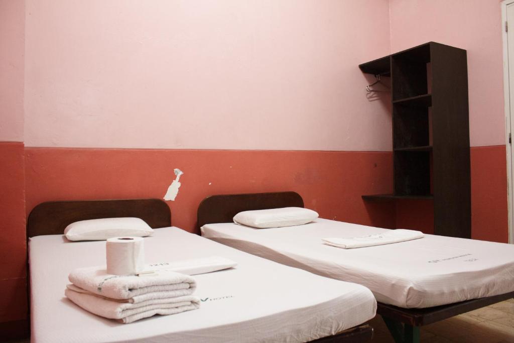 Postel nebo postele na pokoji v ubytování GV Hotel - Baybay