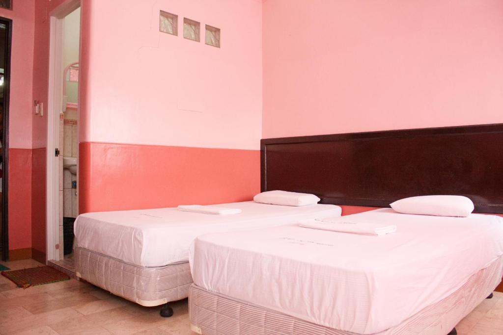 Postel nebo postele na pokoji v ubytování GV Hotel - Baybay