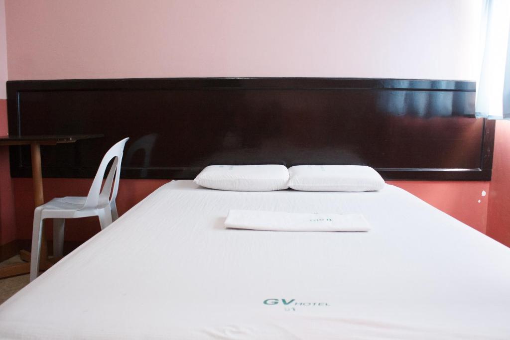 Postel nebo postele na pokoji v ubytování GV Hotel - Baybay