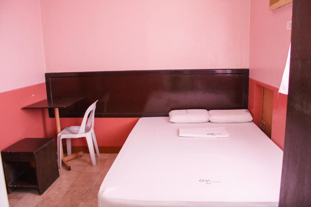 Postel nebo postele na pokoji v ubytování GV Hotel - Baybay