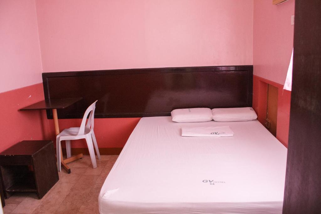 Postel nebo postele na pokoji v ubytování GV Hotel - Baybay