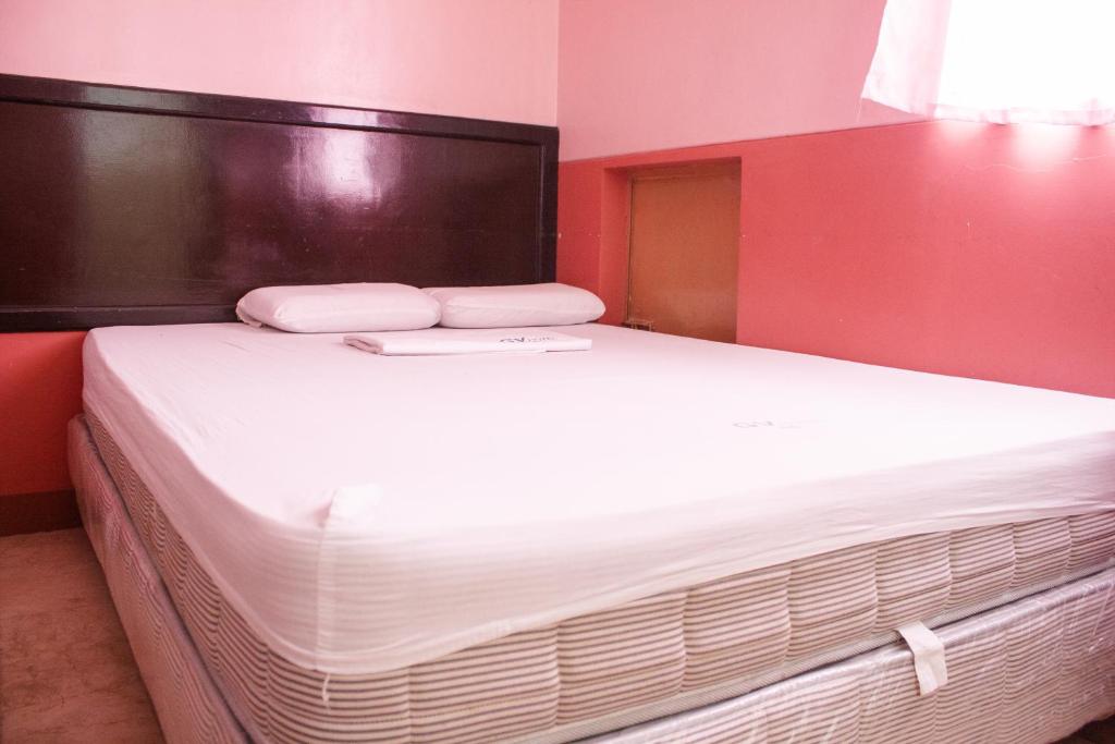 Postel nebo postele na pokoji v ubytování GV Hotel - Baybay