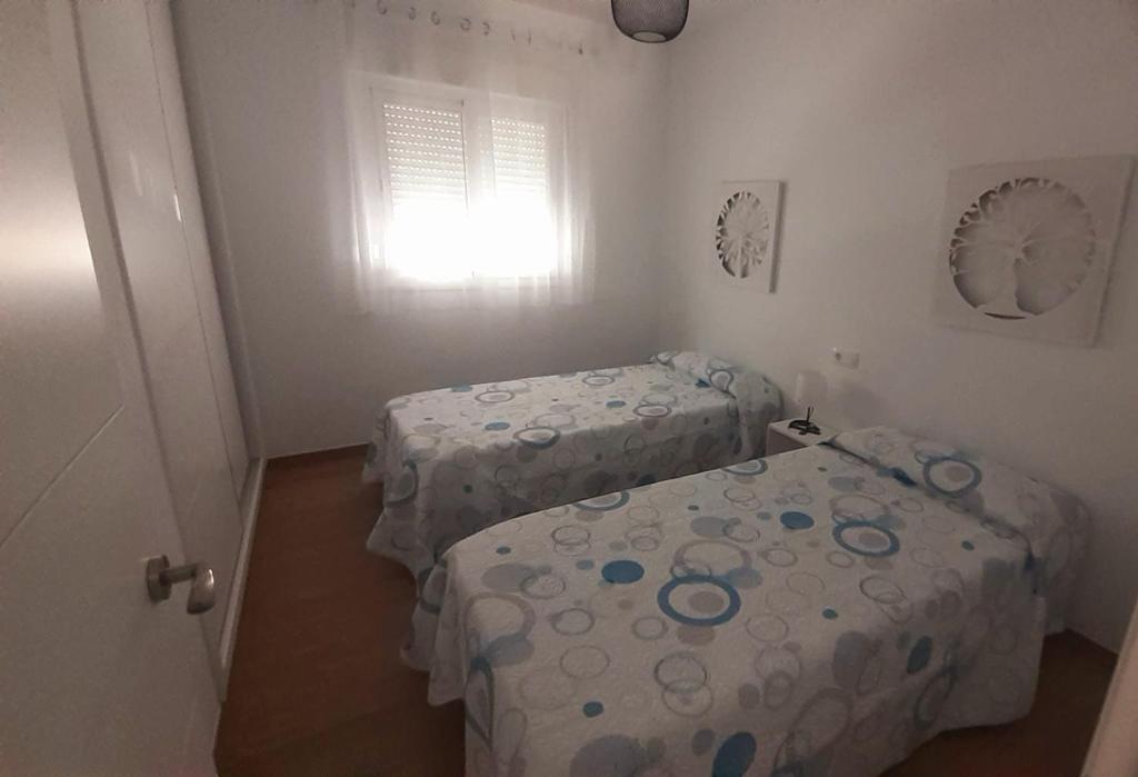 Posteľ alebo postele v izbe v ubytovaní Apartamento CampoMar