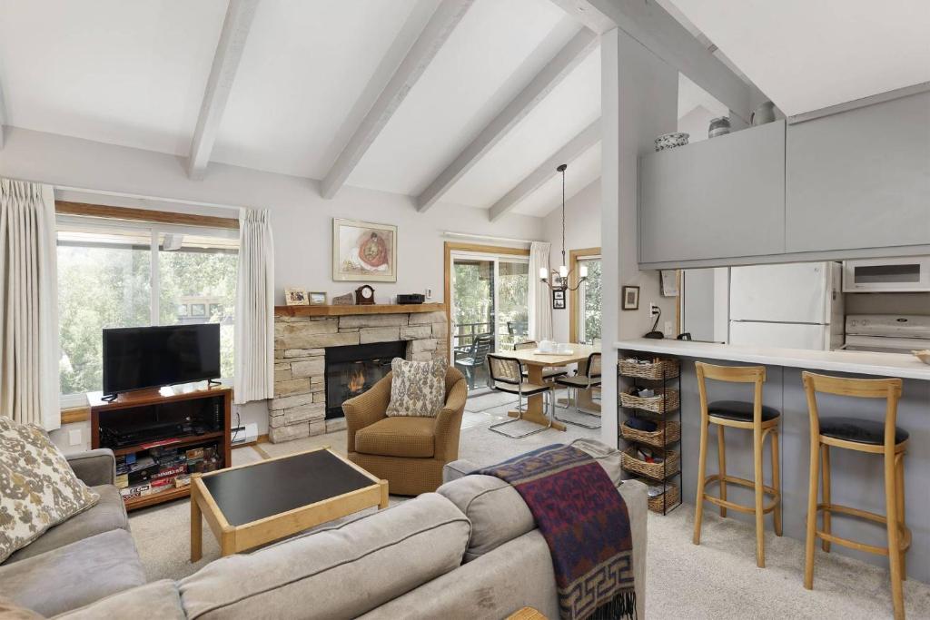 a living room with a couch and a table at Seasons Four 172 Two bedroom plus loft in Snowmass Village