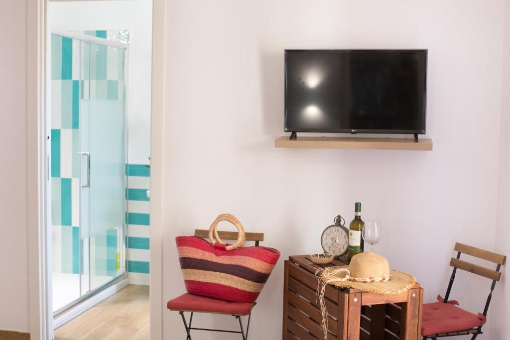 Televízia a/alebo spoločenská miestnosť v ubytovaní Estate4home - SOFIA FLORA