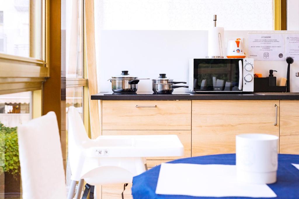 Kuchyň nebo kuchyňský kout v ubytování Mantovani Hotel Murano & Mariù