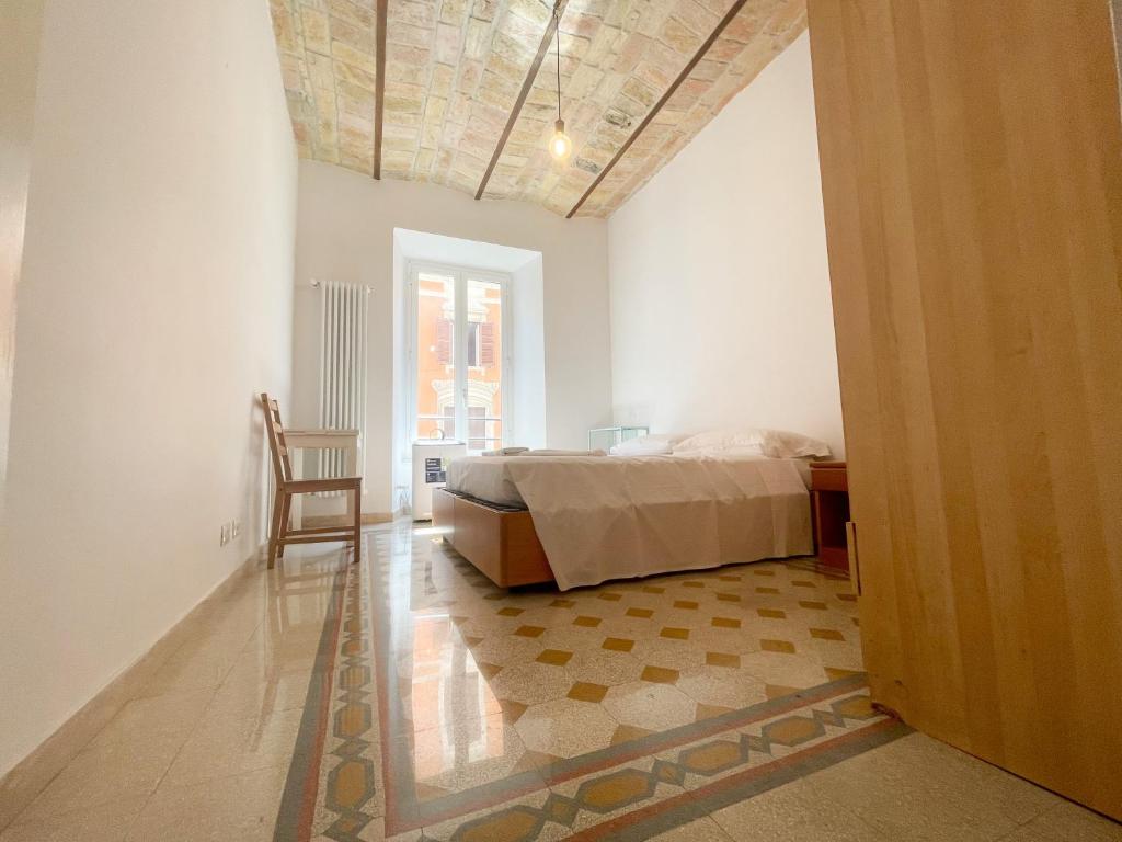 Łóżko lub łóżka w pokoju w obiekcie CAIROLI BOUTIQUE APARTMENT