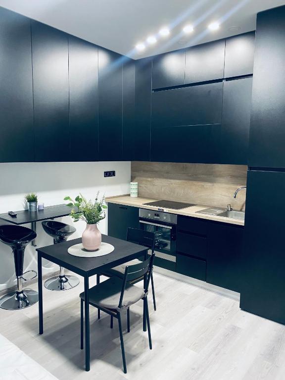 Kuchyň nebo kuchyňský kout v ubytování Sweet Apartment
