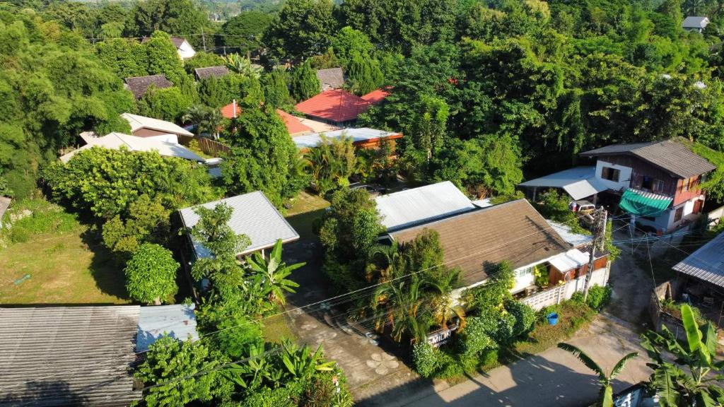 an aerial view of a house in a forest at Milin Guesthouse in Chiang Rai