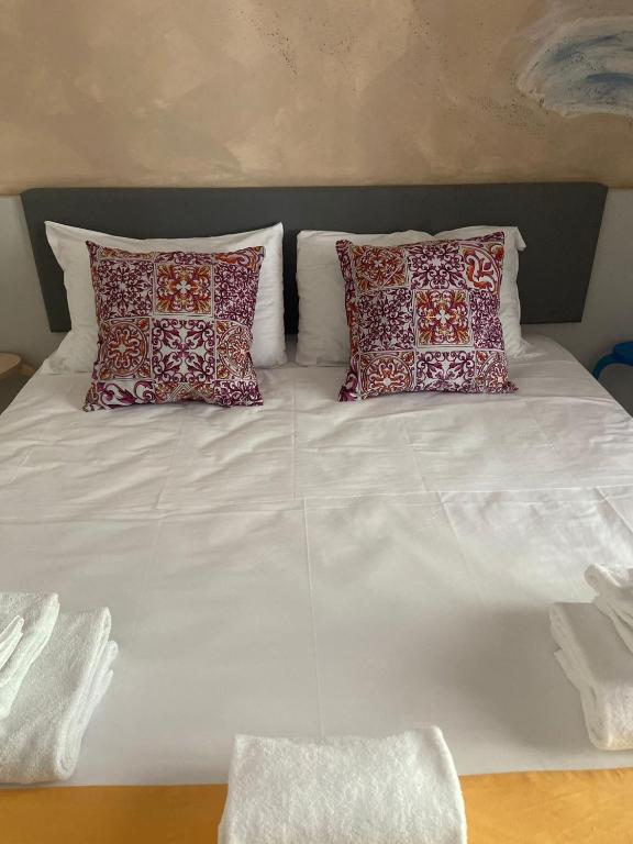 Posteľ alebo postele v izbe v ubytovaní Sorrento B&D Rooms