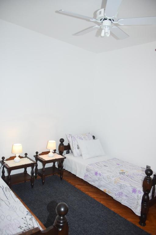 Posteľ alebo postele v izbe v ubytovaní Apartman Plava riba