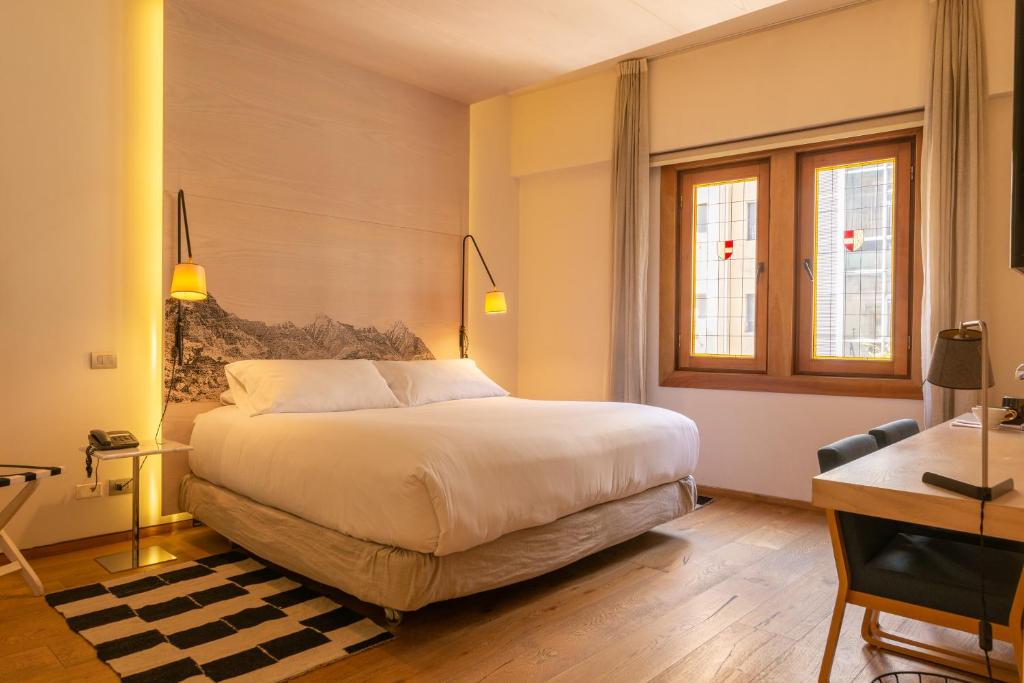 Postel nebo postele na pokoji v ubytování Hotel Magnolia Santiago