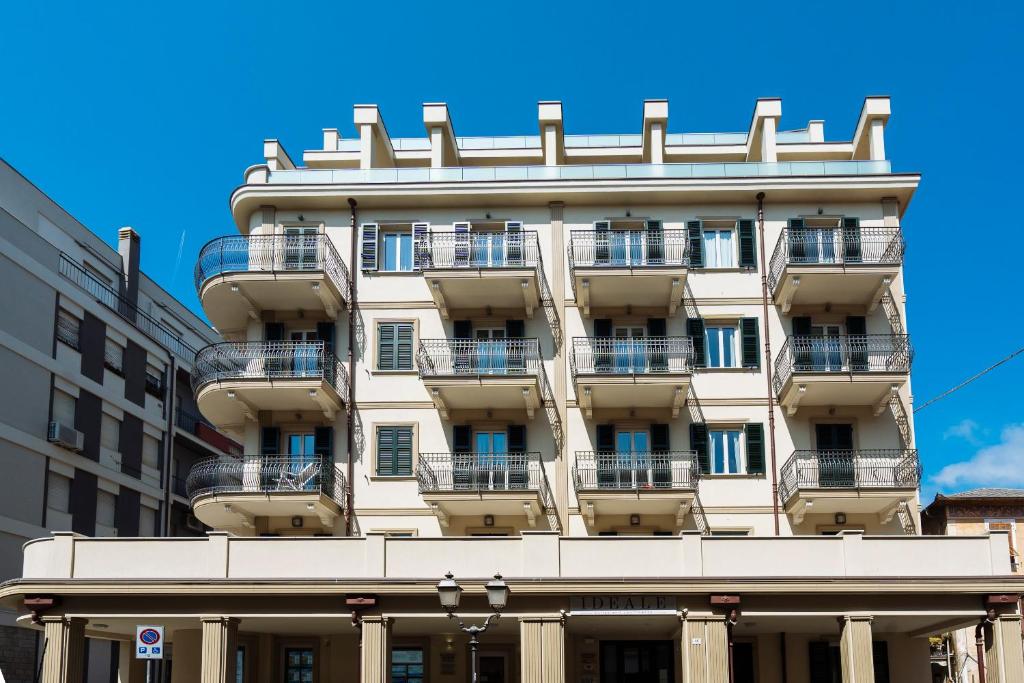 a building with balconies on the side of it at Casa Vacanze Residence Ideale Suites and Apartments in Alassio