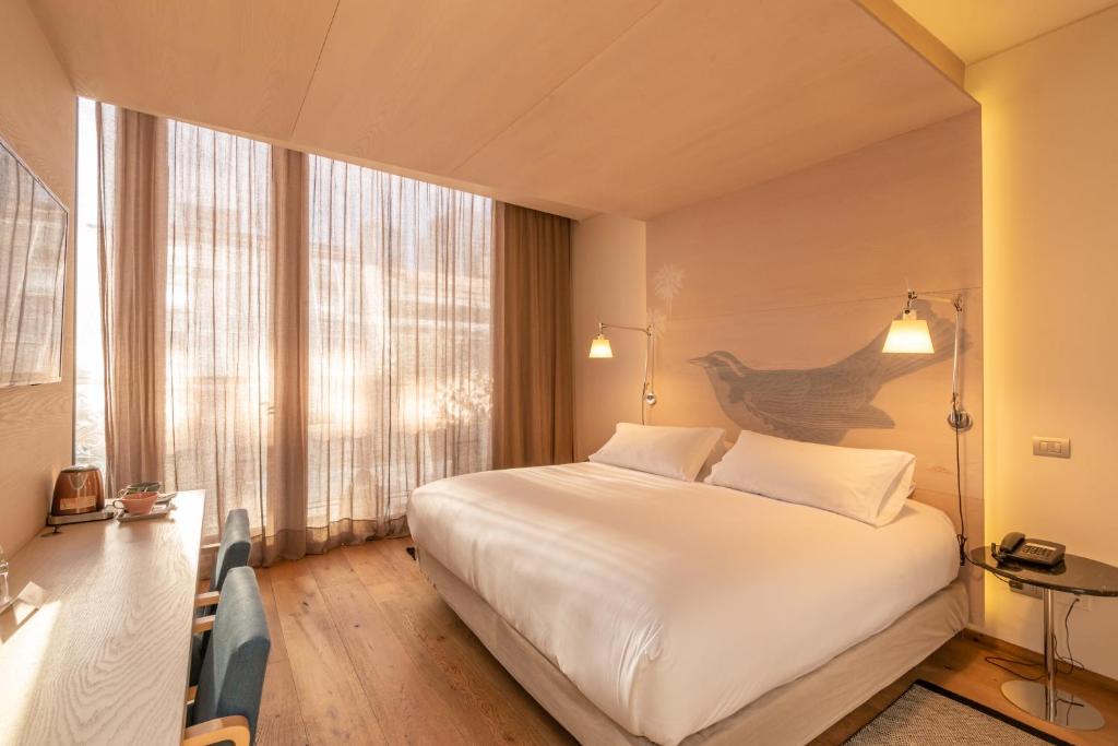 Postel nebo postele na pokoji v ubytování Hotel Magnolia Santiago