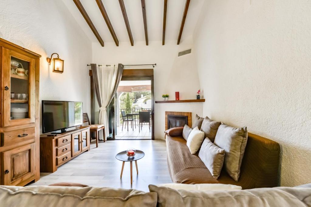 Televízia a/alebo spoločenská miestnosť v ubytovaní Villas Guzman - San Jaime