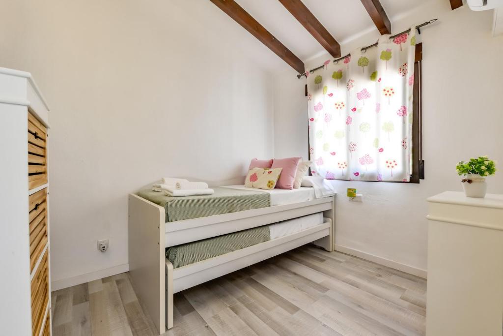 Posteľ alebo postele v izbe v ubytovaní Villas Guzman - San Jaime