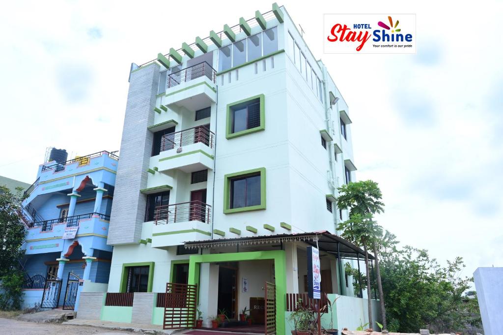 a building in the city of stay sharma at Hotel Stay Shine in Mysore