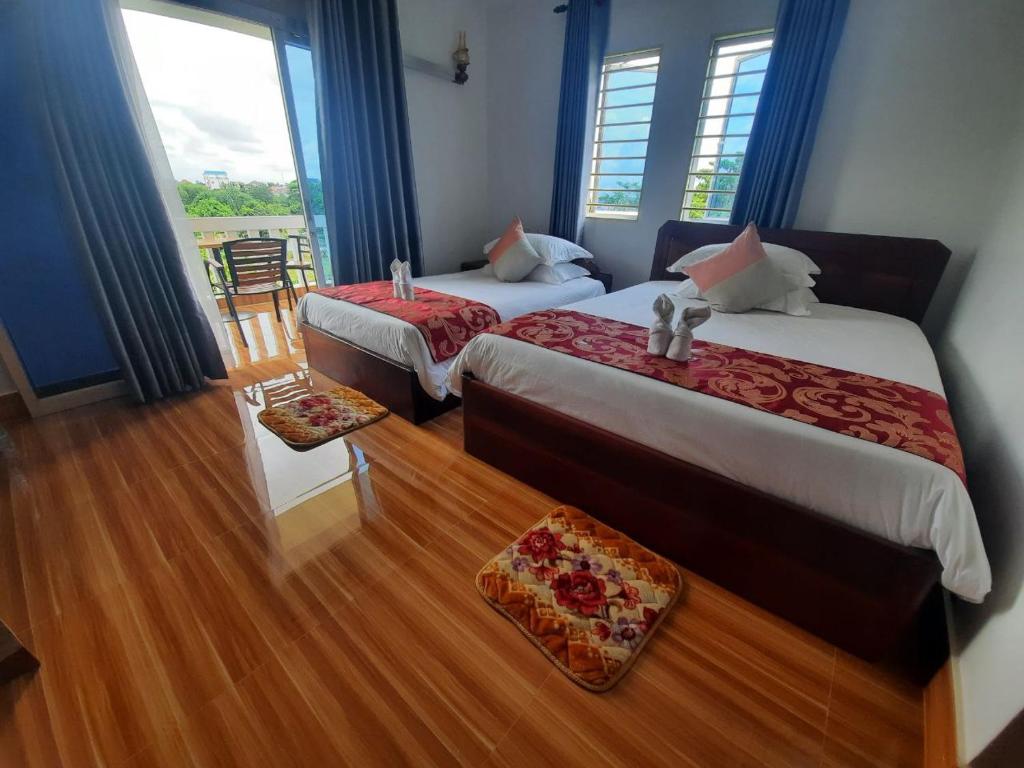 Postel nebo postele na pokoji v ubytování Realkhom Villa