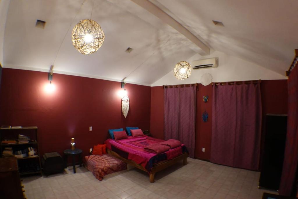 Postel nebo postele na pokoji v ubytování Gardenhotel Macan Ché B&B