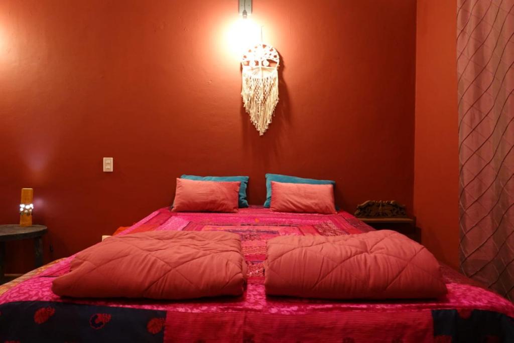 Postel nebo postele na pokoji v ubytování Gardenhotel Macan Ché B&B