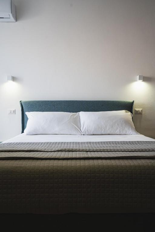 Postel nebo postele na pokoji v ubytování Olea Relais