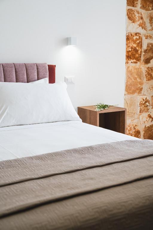 Postel nebo postele na pokoji v ubytování Olea Relais
