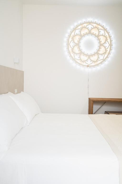 Postel nebo postele na pokoji v ubytování Olea Relais