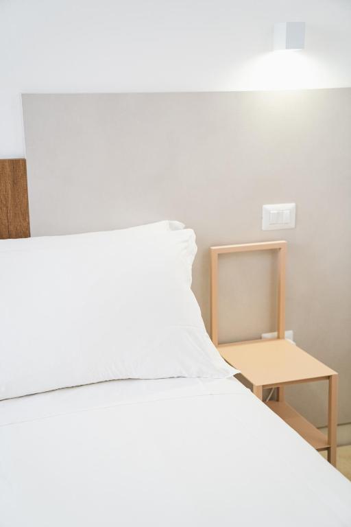 Postel nebo postele na pokoji v ubytování Olea Relais