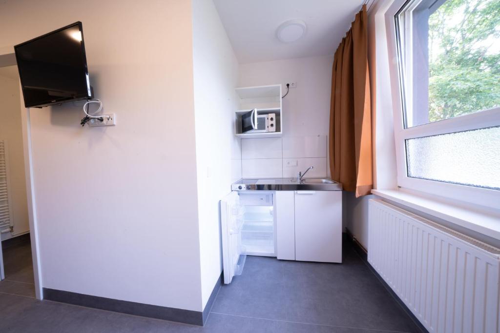 Kuchyň nebo kuchyňský kout v ubytování NeoHostel