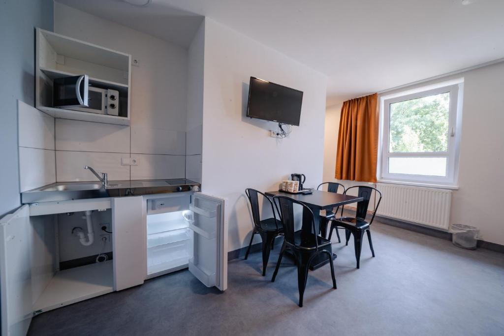 Kuchyň nebo kuchyňský kout v ubytování NeoHostel