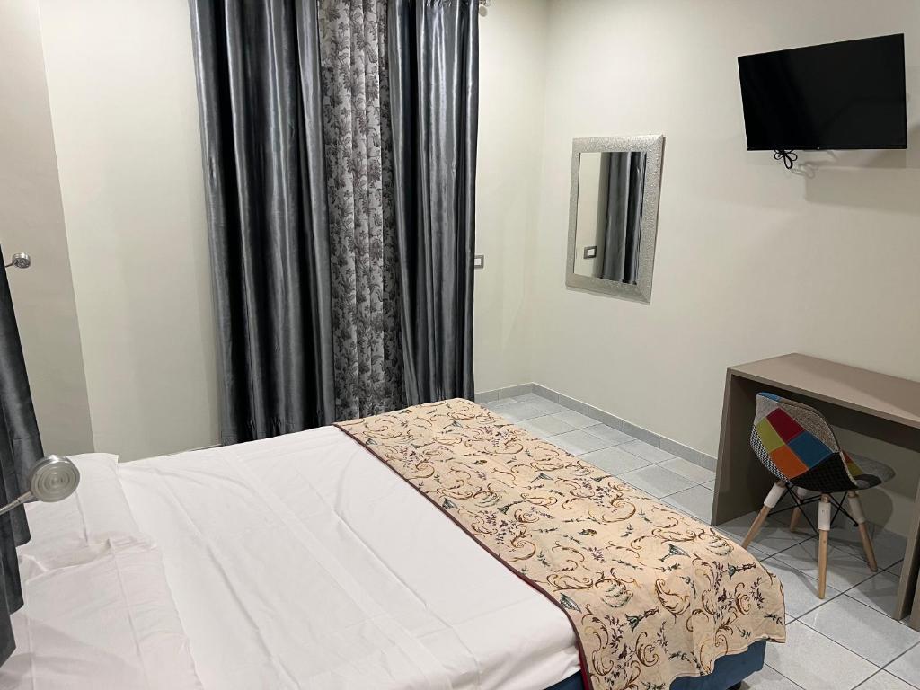Posteľ alebo postele v izbe v ubytovaní Akoya Rooms Capo Vaticano