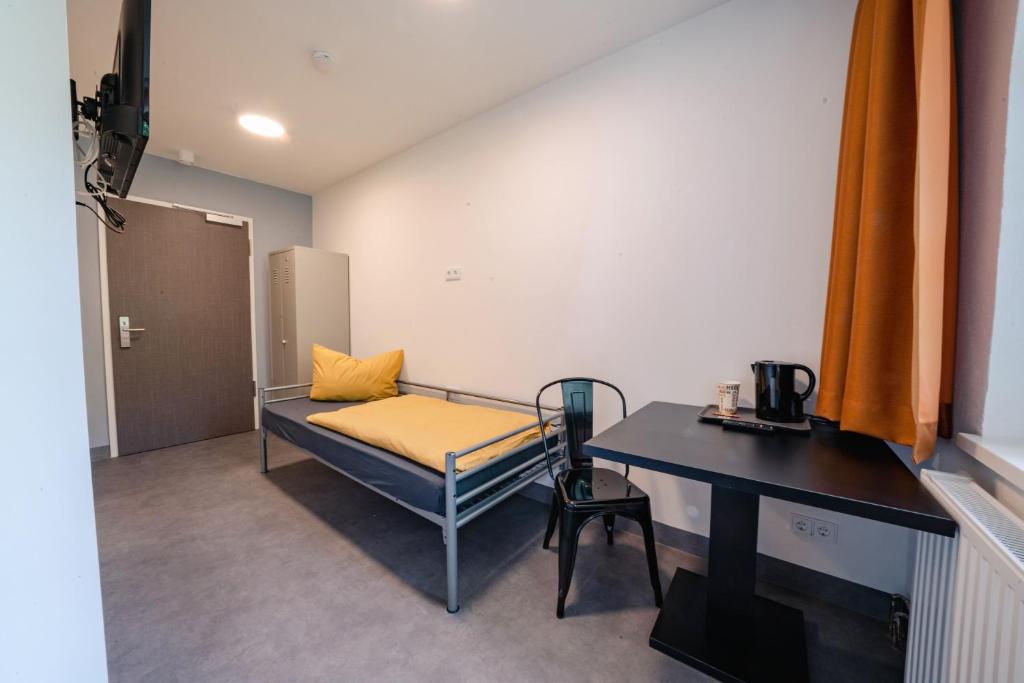 Postel nebo postele na pokoji v ubytování NeoHostel