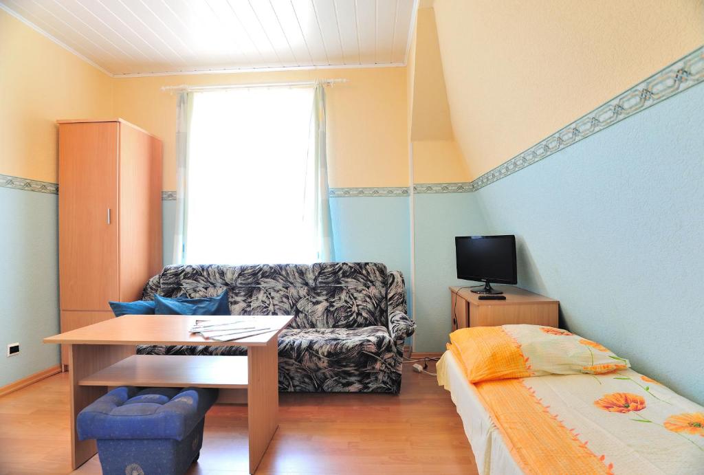 Televízia a/alebo spoločenská miestnosť v ubytovaní Villa Bajka